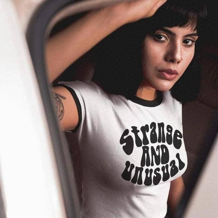 Strange and Unusual Unisex Ringer Tee (XS - 3XL)